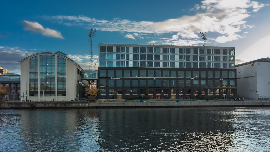 Modern building with curved windows against blue sky