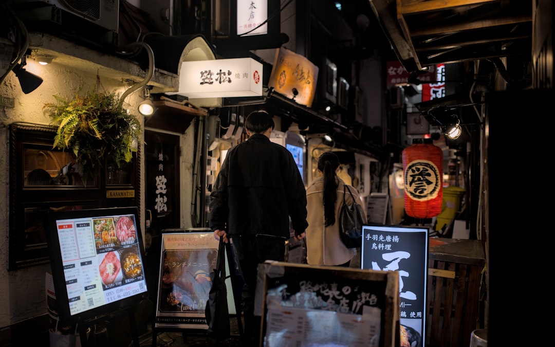A cell phone sitting on top of a keyboard