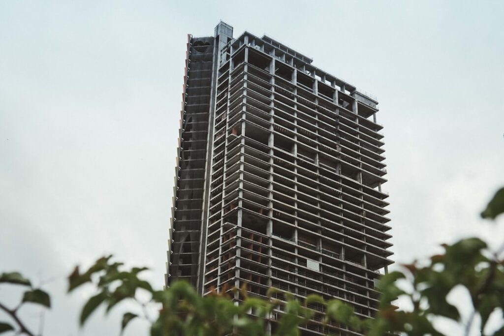 Modern building with curved facade against blue sky