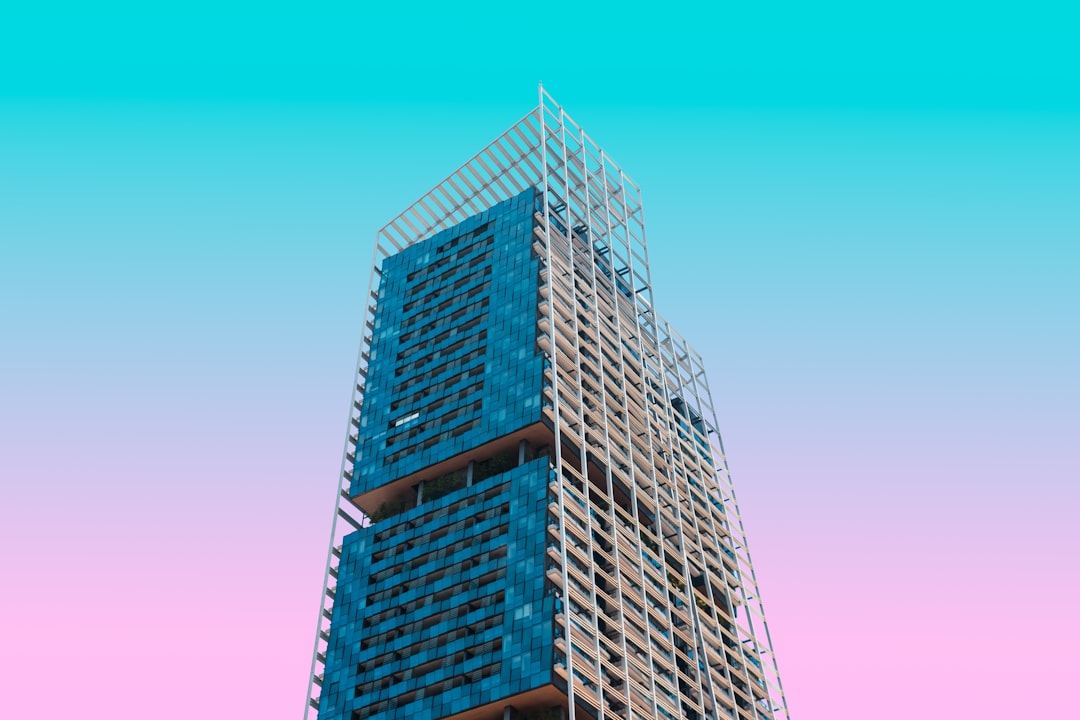 Rows of windows on a brick building facade.