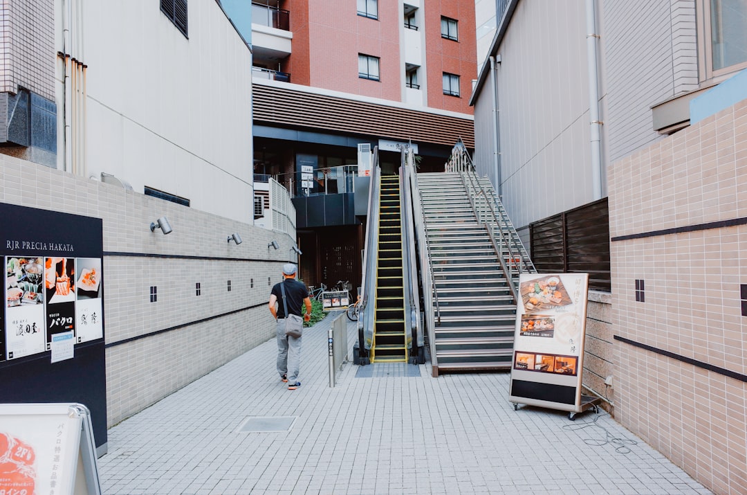 Modern apartment building with balconies and awnings.