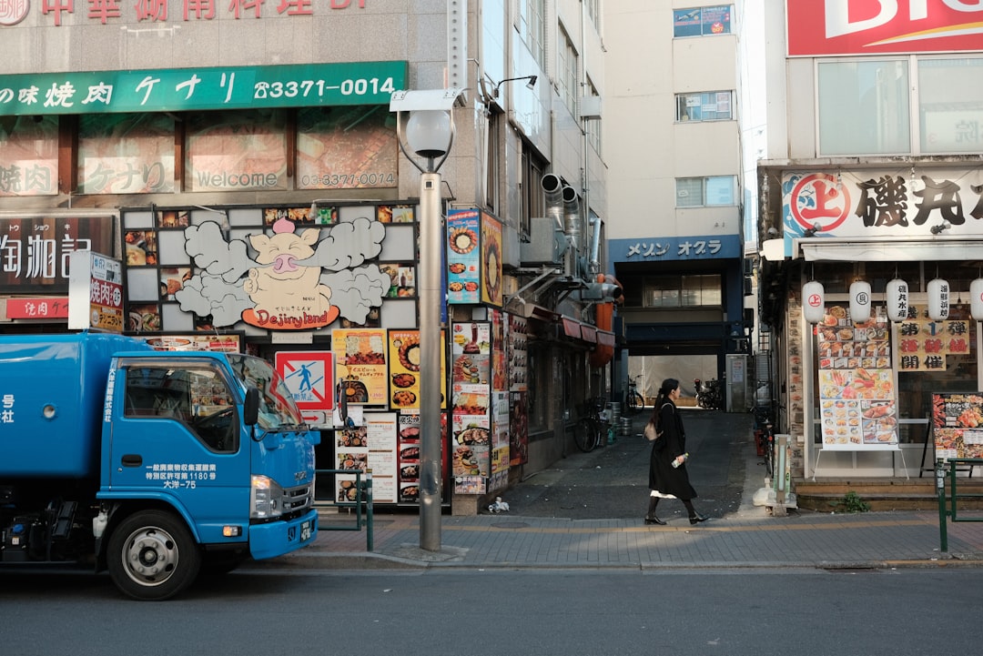 a person writing on a piece of paper