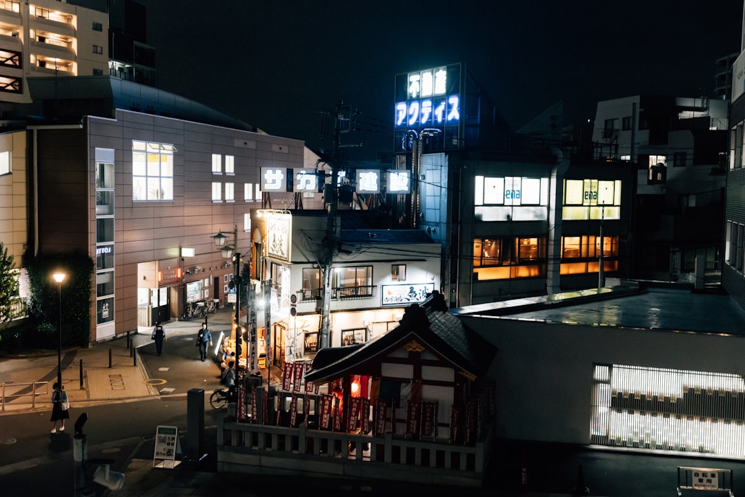 brown concrete building with glass windows